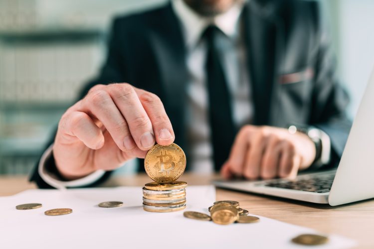 Bitcoin brokerage concept, businessman with cryptocurrency coins
